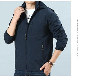 Detail showing hooded collar and hidden chest pocket of a dark blue outdoor jacket