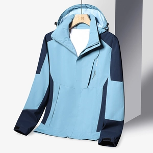 Waterproof outdoor hooded jacket for hiking in light blue and navy color-block design