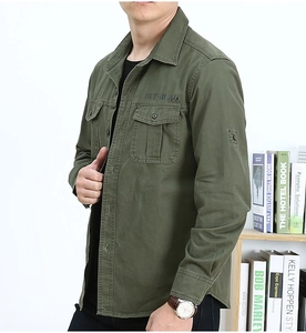 Close-up detail of military green work shirt with OFF-ROAD embroidery and double chest pockets