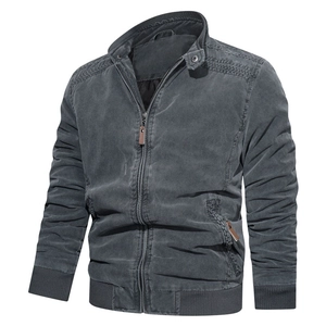 Detail of vintage washed cotton jacket showing ribbed cuffs and brown leather zipper puller