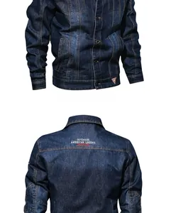 Close-up of vintage blue denim jacket with embroidery detail and metal buttons