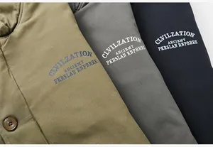 Detailed close-up of thick cotton fabric texture with embroidery on work jackets