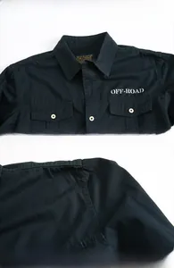 Detail of navy cotton utility shirt showing OFF-ROAD print and double chest flap pockets