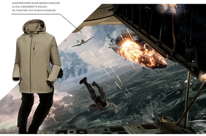 Detail view of khaki tactical hooded softshell jacket with cargo pants and combat gear