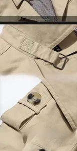 Detail of khaki cotton jacket showing plaid collar lining and metallic D-ring buckle
