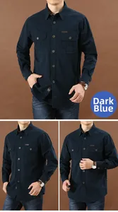 Close-up of deep blue workwear shirt with dual buttoned pockets and leather patch