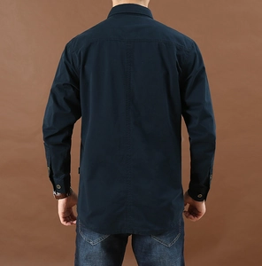 Detail view of navy blue cotton shirt back with stitching and shoulder yoke design