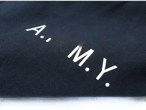 Detailed macro view of white A.R.M.Y. printed text on heavy twill cotton fabric