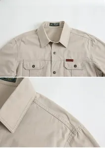 Close-up detail of khaki outdoor shirt collar with logo label and durable stitching