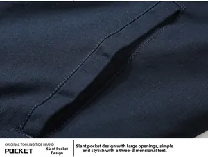 Detailed view of the large slanted pockets and twill fabric on navy pilot jacket