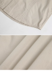 Detail of light khaki twill cotton fabric with high-quality double-stitched hem finish