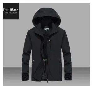 Detail view of a lightweight black hooded windbreaker jacket with secure zip pockets