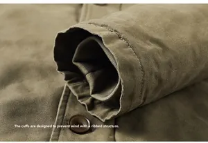 Detail of ribbed windproof cuffs and button closure on men's heavy cotton work jacket