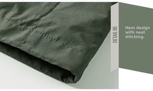 Macro shot of dark green jacket hem with high-quality double-needle stitching detail