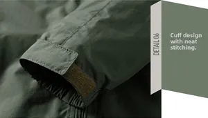 Detail of adjustable velcro cuffs and windproof fabric on a green outdoor jacket