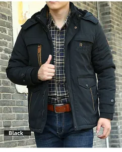 Detail of men's winter hooded jacket with faux fur collar and secure double closure