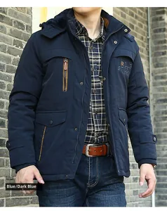 Detail of navy blue winter parka with fleece lining, hood, and rib-knit cuffs for men