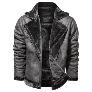 Detail of charcoal grey shearling jacket featuring thick faux fur lining and suede finish