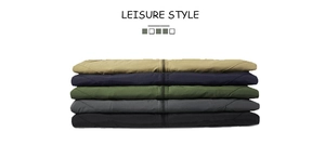 Detail view of colorful casual vests stacked in khaki, navy, olive, grey and black colors