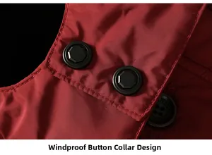 Macro shot of windproof button collar on burgundy padded winter coat for elderly men