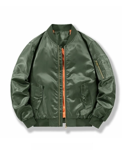 Detail of olive green MA-1 bomber jacket featuring orange lining and classic arm zipper
