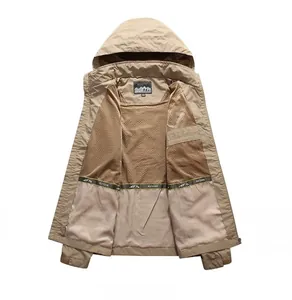 Detail of khaki outdoor jacket showing breathable mesh lining and interior outdoor ribbon