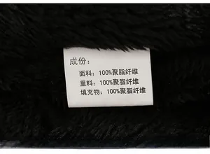 Detail view of clothing care label showing 100% polyester material for padded coat