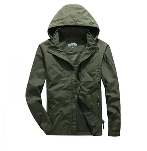 Detailed close-up of army green tactical jacket with hood and brand embroidery