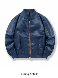 Detail of bomber jacket showing bright orange inner lining and durable metal zipper