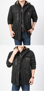 Detail of windproof men's jacket with orange fleece lining and rough stock embroidery