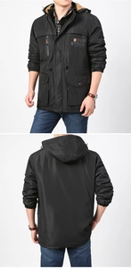 Detail view of men's black outdoor jacket with multi-pockets and soft fleece lining