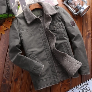 Men's sage green fleece-lined jacket with American Legend embroidery on wood background