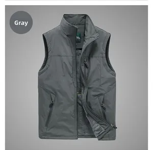 Detail of grey outdoor vest featuring fleece lining, standing collar, and zip pockets