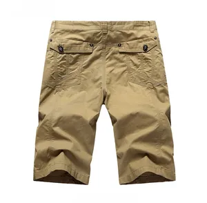Detail view of khaki cotton cargo shorts featuring flap pockets and secure black buttons
