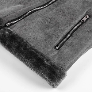 Detail view of gray faux suede jacket featuring warm faux shearling lining and metal zippers