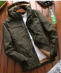 Detail of army green outdoor jacket with thick warm brown fleece lining and hooded design