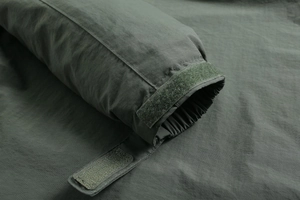 Close-up of adjustable velcro cuffs and elastic windproof lining on men's outdoor jacket