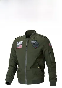 Detail of army green bomber jacket with military embroidery and American flag patches