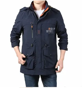 Close-up of men's dark blue outdoor jacket with orange zippers and ROUGH STOCK print