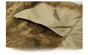 Detail of fleece lining vest showing inner safety pocket with hook-and-loop fastener