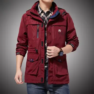Detail of burgundy windproof hooded jacket with utility pockets and waist drawstring