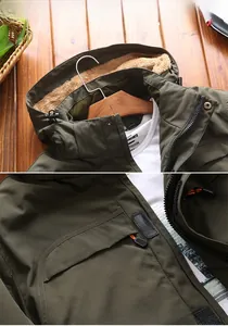 Detailed view of olive green jacket with thick fleece lining and orange zipper pulls