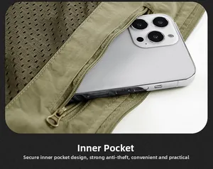 Détail du gilet utilitaire montrant une poche intérieure zippée sécurisée avec doublure filet