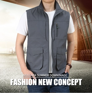 Detailed close-up of dark grey outdoor cargo vest featuring functional multi-pockets design