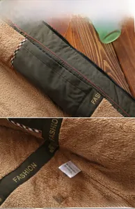 Detailed macro view of olive green jacket with thick warm brown fleece lining and inner pocket