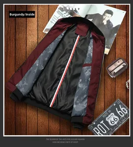 Detail view of burgundy baseball jacket interior with tricolor ribbon and striped lining