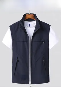 Detailed close-up of dark blue outdoor utility vest with zipper pockets and stand collar