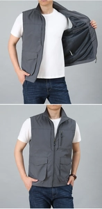 Detail view of dark grey functional multi-pocket vest with breathable mesh lining