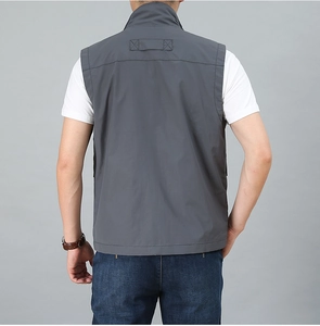 Rear view of grey multi-pocket vest showing smooth fabric texture and seam details