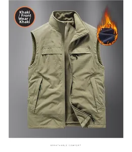 Detail view of khaki reversible outdoor vest with stand collar and zipper pockets
